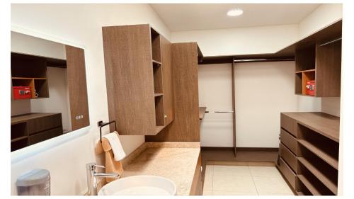 a bathroom with a sink and a toilet in a room at AdyHouse Tres Cantos in Cedro