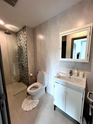 a bathroom with a toilet and a sink and a mirror at B9 Ватсап669З5В2I976 in Nai Yang Beach