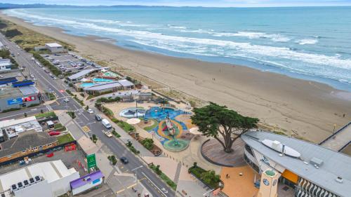 an aerial view of a beach with a water park at Christchurch Backpackers in Christchurch