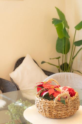 a basket of flowers sitting on a table at Peaceful Garden Home in Ota, Entire 3BR Parking in Ota