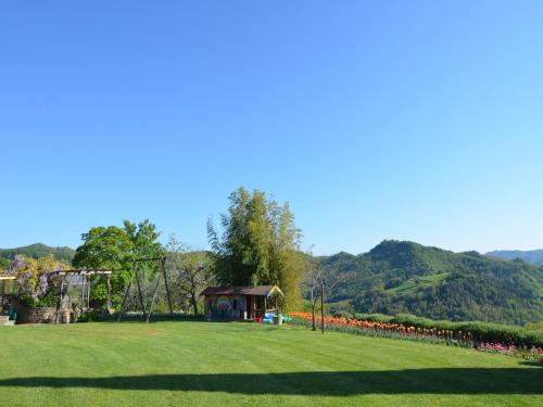 a park with a playground and a gazebo at Apartment in quiet and green environment with swimming pool in Modigliana