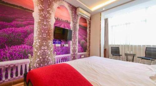 a bedroom with a large bed with a purple wall at Super 8 Hotel Jinan Railway Station Square in Jinan