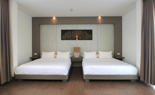 En eller flere senge i et værelse på Villa Maisha by REJA Villas