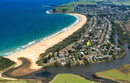 an aerial view of a beach next to the ocean at Araluen House Werri Beach Gerringong in Gerringong