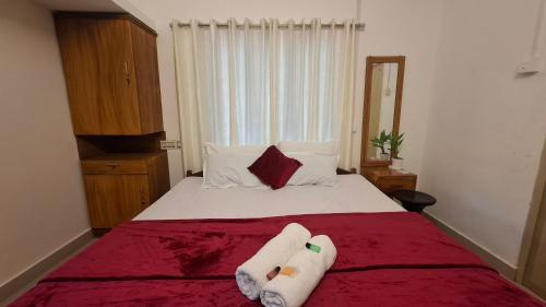 Postel nebo postele na pokoji v ubytování Purayilhomestay