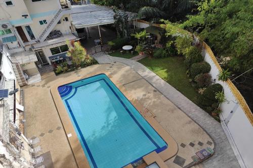 an overhead view of a swimming pool in a yard at Elicon Suites Resort Bohol near City Center in Tagbilaran City