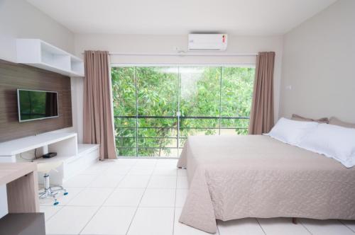 Postel nebo postele na pokoji v ubytování Flat Beira Rio