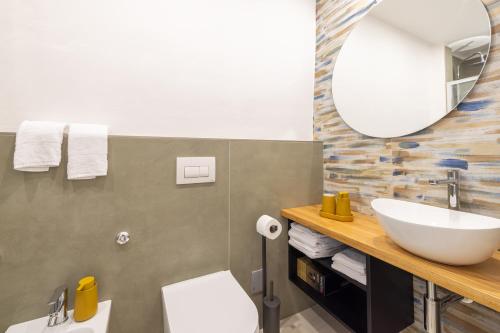 a bathroom with a sink and a mirror at Casa Annunziata Guest House in Ruffano