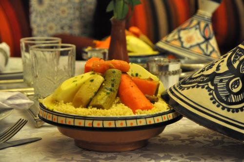 a plate of vegetables and rice on a table at Mont Gueliz in Marrakech