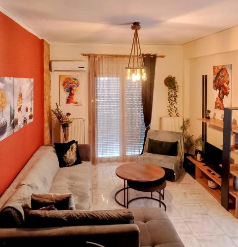 a living room with a couch and a table at home2024 in Alexandroupoli