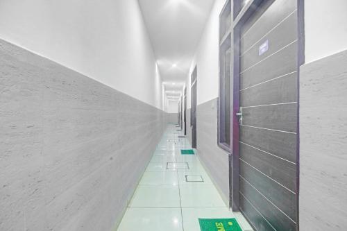 a hallway of a building with a long corridor at Super Hotel O Sector 52 Chandigarh Formerly Hotel Muskan in Chandīgarh