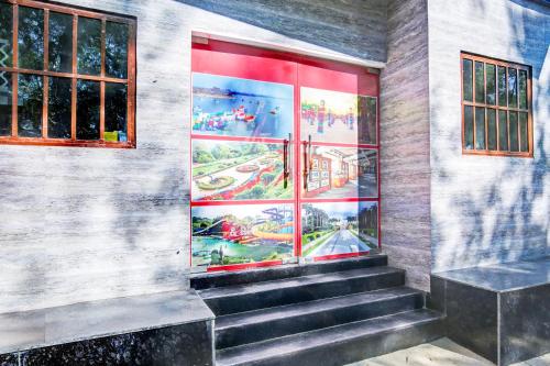 a painting of the entrance to a building with stairs at Super Hotel O Sector 52 Chandigarh Formerly Hotel Muskan in Chandīgarh