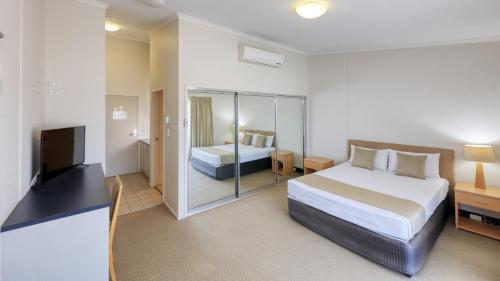 Ένα ή περισσότερα κρεβάτια σε δωμάτιο στο Capella Coach Inn