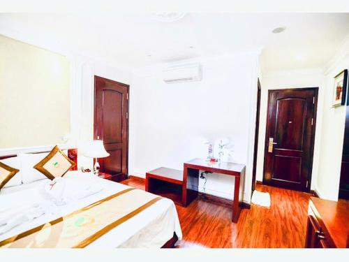 ORANGE Hotel & Suites - Danang City CENTER, near Dragon Bridgeにあるベッド