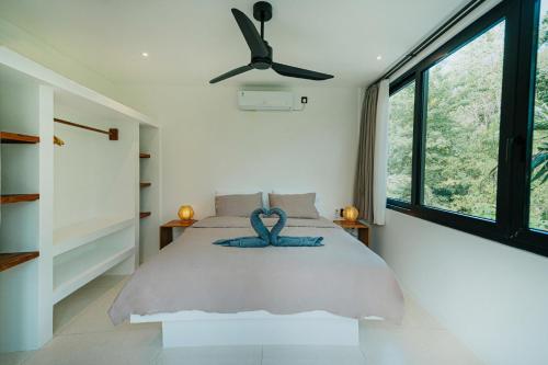 Ένα ή περισσότερα κρεβάτια σε δωμάτιο στο Villa Enam