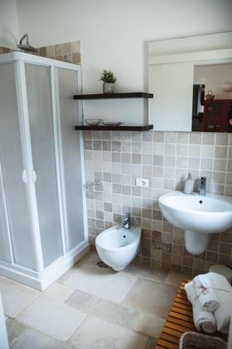 a bathroom with a sink and a toilet at Villa Catia in Alberobello