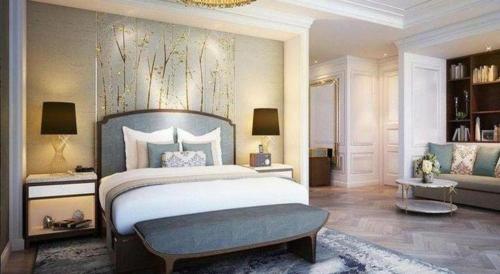 a bedroom with a large bed and a couch at Xian Jue Vu Hotel in Xi'an