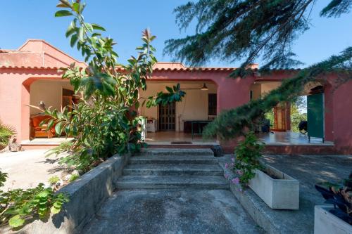 a house with stairs leading to the front yard at Sprocketlandia in Frigole