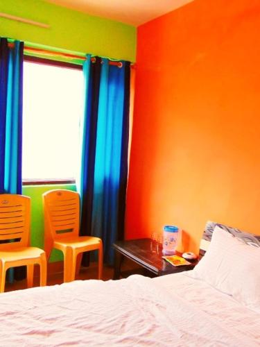Postel nebo postele na pokoji v ubytování Parvat View Homestay