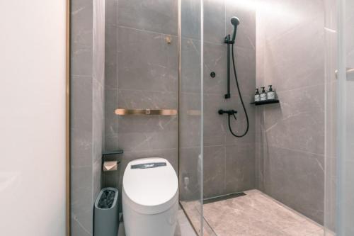 a shower stall with a toilet in a bathroom at Atour X Hotel Shanghai Pudong Babaiban in Shanghai
