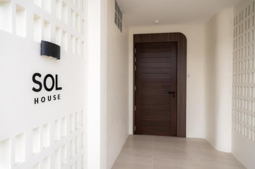 a hallway with a door in a house at SOL HOUSE kohlarn in Ko Larn