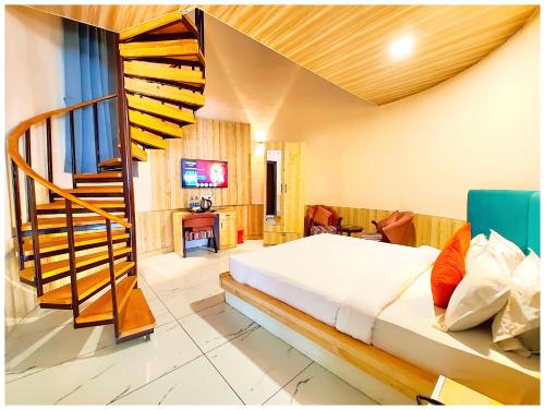 a bedroom with a bed and a staircase in it at NAINITAL HOTEL A LUXURIOUS RESORT'S PRANAV! INN - Free Parking & Wi-fi - Restaurant & Room Service - Spacious & Comfortable Rooms With Hill View Available -Near Bhowali Road - Best Hotel In Nainital in Bhowāli