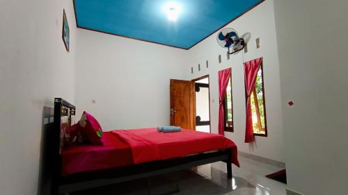 Ένα ή περισσότερα κρεβάτια σε δωμάτιο στο Odentick Homestay