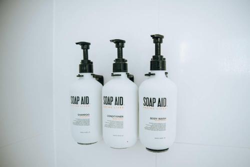 a group of four shampoo bottles sitting on a counter at Comfort Inn Moree in Moree