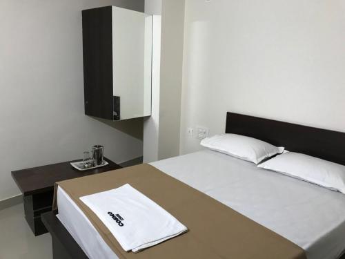 Postel nebo postele na pokoji v ubytování COSMO LODGE