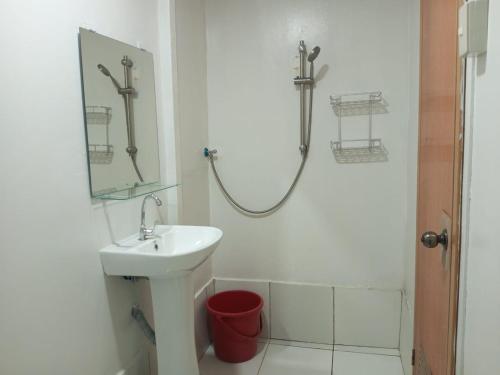 a bathroom with a sink and a shower at El Nido mama hostel in El Nido