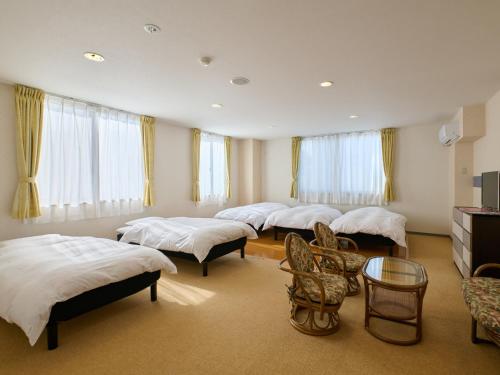Postel nebo postele na pokoji v ubytování Owara View Hotel