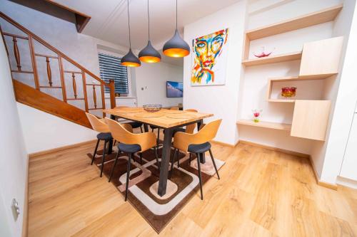 a dining room with a table and chairs at Vila Malenovice in Malenovice