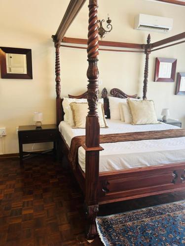 Ein Bett oder Betten in einem Zimmer der Unterkunft His Oath Guesthouse