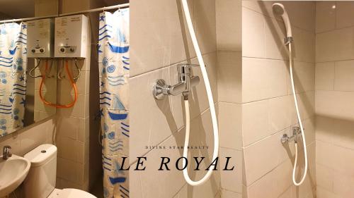 a bathroom with a shower with a toilet and a sink at Le Royal Benson Apartment at Supermal Pakuwon in Surabaya
