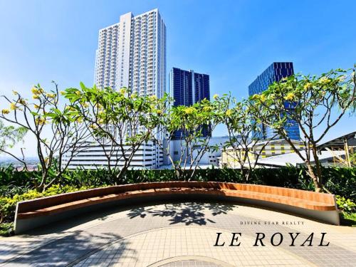 a sign in front of a city with tall buildings at Le Royal Benson Apartment at Supermal Pakuwon in Surabaya