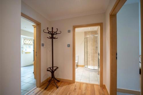 a hallway with a pole in the middle of a room at 10mins to St Andrews and Dundee 5mins to Tentsmuir Forest and beach in Leuchars