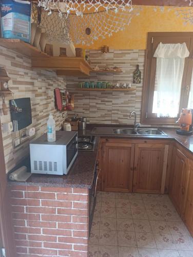 Η κουζίνα ή μικρή κουζίνα στο Villa Aurora