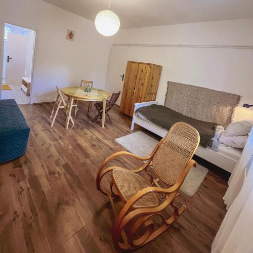 a living room with a couch and a table at Bolgárkert Family House in Budapest