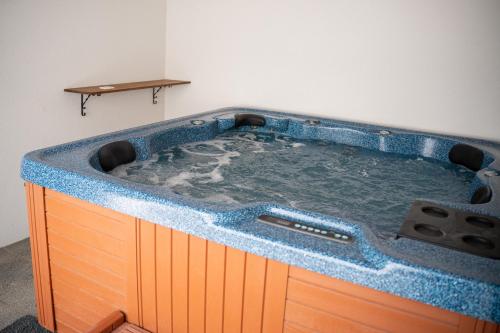 a jacuzzi tub in the corner of a room at Vila Malenovice in Malenovice