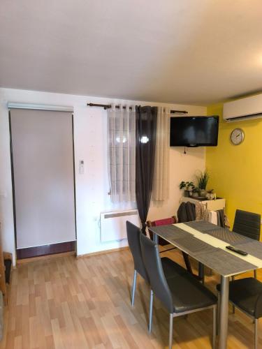 a dining room with a table and chairs at Apartma Dian in Mostec