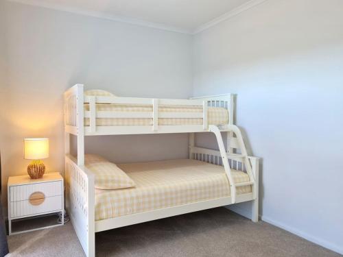 a couple of bunk beds in a room at Azure Haven Holiday Home in Port Hughes