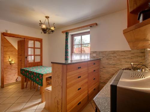 a kitchen with a table and a dining room at Apartament Krupówki 73 - 2-7 person in Zakopane