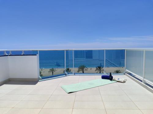 a yoga room with a view of the ocean at Hotel Calella by Beatriz Hoteles in Calella