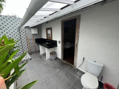a bathroom with a toilet and a sink at Villa Louise in Badung