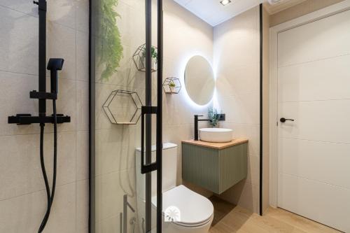 a bathroom with a shower with a toilet and a sink at Mediterranean Way - Punta Prima 17 in La Pineda