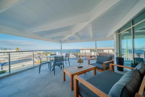 a living room with a view of the ocean at One Marine Drive Boutique Hotel & Spa by The Living Journey Collection in Hermanus
