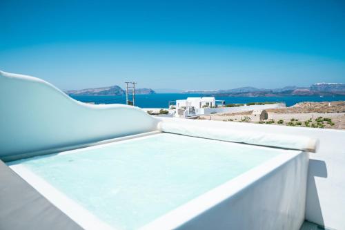 a view of the ocean from the balcony of a house at Serenità Luxury Suites in Akrotiri