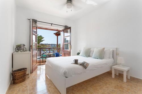 En eller flere senge i et værelse på Casa Taylooney