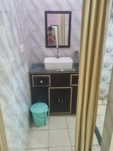 a bathroom with a sink and a mirror at Hotel Sandeep palace in Jāmb