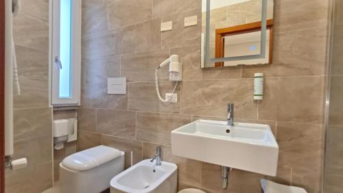a bathroom with a sink and a toilet at Valmarina in Calenzano